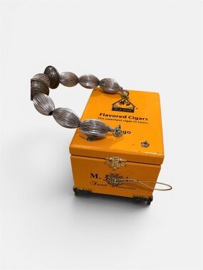 Orange Vintage-Style Jewelry Box with Silver Beaded Bracelet